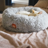Cat sleeping in Grey Plush Donut Cat Bed