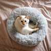 Cat sitting in Grey Plush Donut Cat Bed