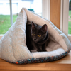 Cat sitting in Heathered Teal Grey Hut Cat Bed